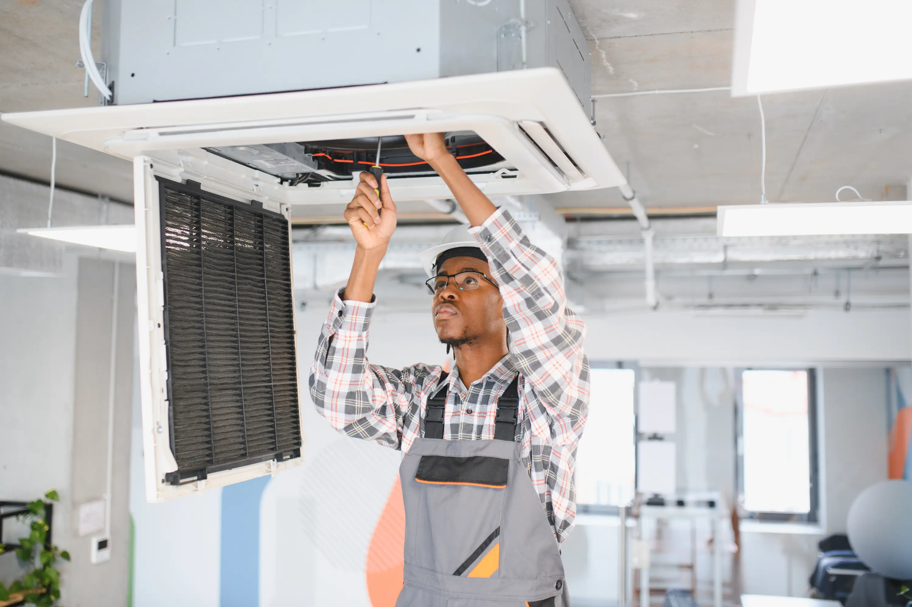 african-american-skilled-technician-repairing-offi-2026-01-09-11-40-57-utc.webp