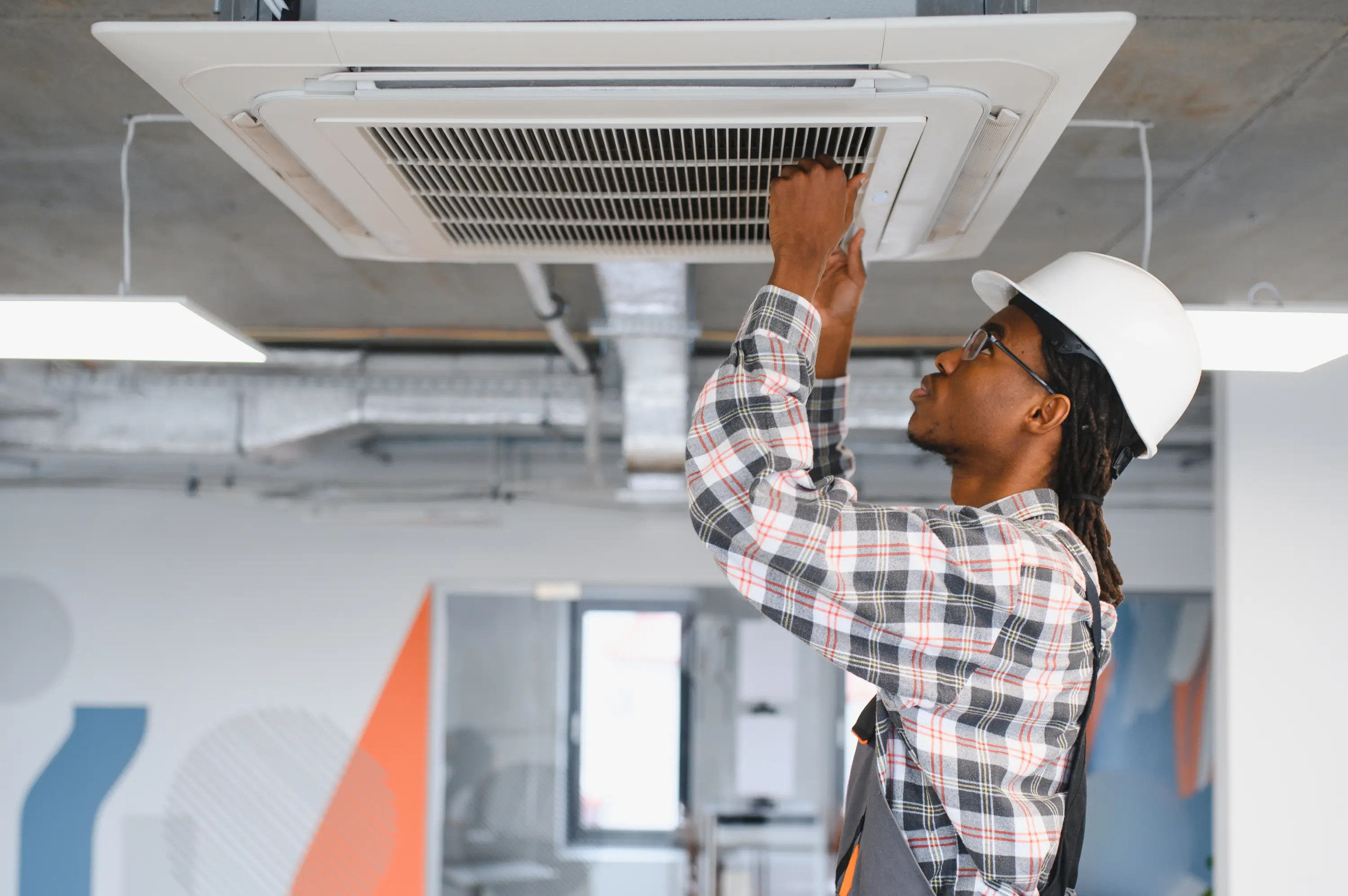 skilled-technician-repairing-office-air-conditioni-2026-01-11-10-14-30-utc.webp